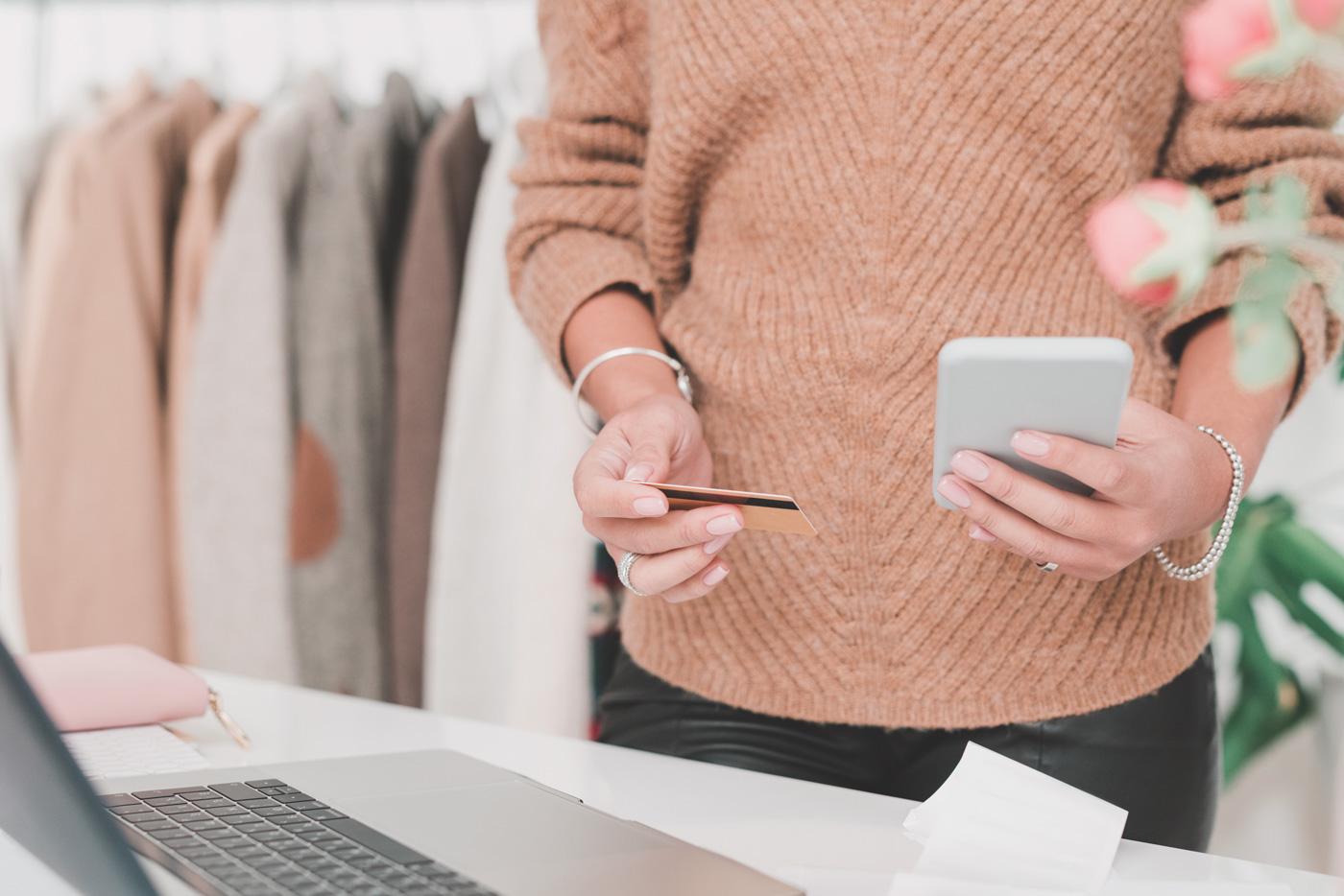 Holding-Smartphone-And-Credit